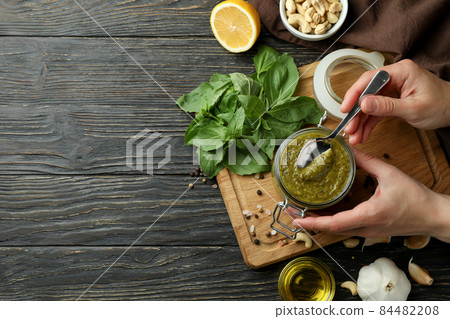 Concept of cooking Pesto sauce on wooden background Concept of cooking Pesto sauce on wooden background 84482208