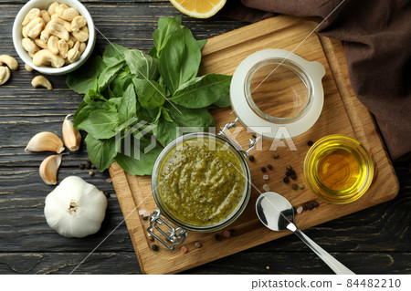 Pesto sauce and ingredients for cooking on wooden background 84482210