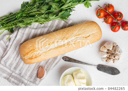 Homemade tasty bread with garlic, and herbs ingredients, on white stone table background, top view flat lay 84482265
