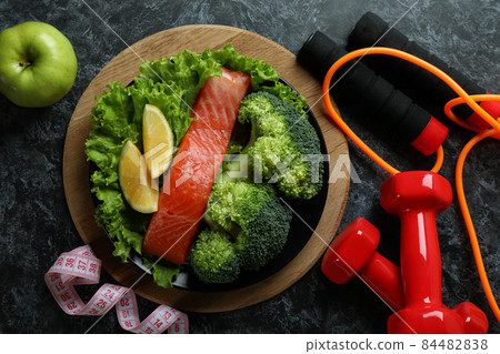 Healthy lifestyle accessories on black smokey table Healthy lifestyle accessories on black smokey table 84482838