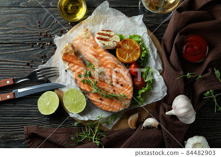 Concept of tasty eating with grilled salmon, top view Concept of tasty eating with grilled salmon, top view 84482903