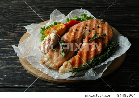 Concept of tasty eating with grilled salmon, close up Concept of tasty eating with grilled salmon, close up 84482904