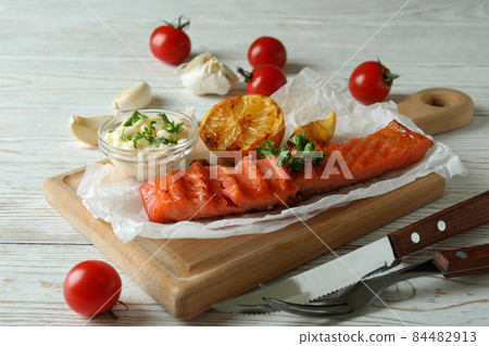 Concept of tasty eating with grilled salmon, close up Concept of tasty eating with grilled salmon, close up 84482913
