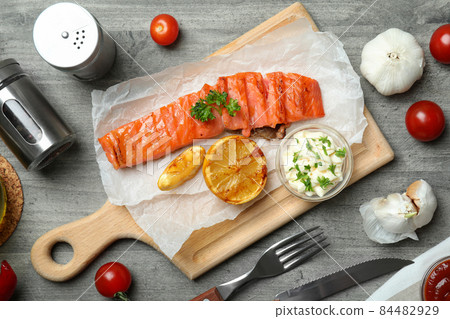 Concept of tasty eating with grilled salmon, top view 84482929