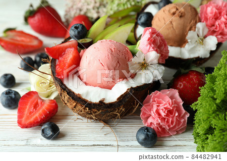 Concept of delicious fruit ice cream on wooden table 84482941