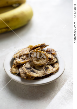 Banana chips. Homemade organic dried banana healthy snack Banana chips. Homemade organic dried banana healthy snack 84483891