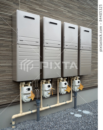 Gas water heaters lined up on the wall of the apartment 84485325