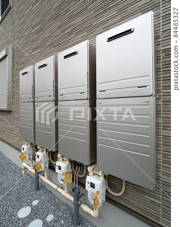 Gas water heaters lined up on the wall of the apartment 84485327