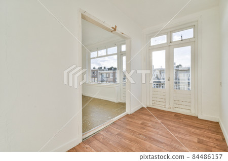 Modern room with wooden floor and white walls 84486157