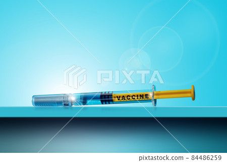 Vaccine Syringe on blue Table and Background with Copy Space Vaccine Syringe on blue Table and Background with Copy Space 84486259