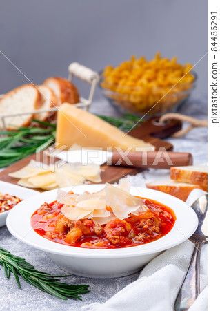 Homemade minestrone soup with cavatappi pasta, beans and vegetables, vertical Homemade minestrone soup with cavatappi pasta, beans and vegetables, vertical 84486291