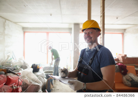 Smiling professional worker hold clipboard and list work materials Smiling professional worker hold clipboard and list work materials 84486366