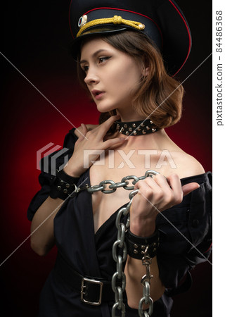 a girl in a military police uniform for sexual games in leather handcuffs and a collar with a chain a girl in a military police uniform for sexual games in leather handcuffs and a collar with a chain 84486368