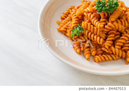 spirali or spiral pasta with tomato sauce spirali or spiral pasta with tomato sauce 84487013