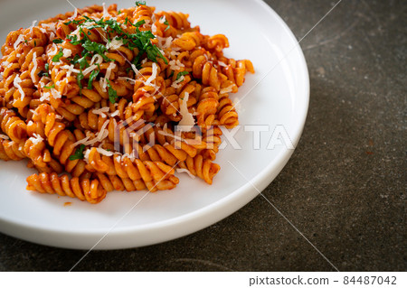 spirali or spiral pasta with tomato sauce spirali or spiral pasta with tomato sauce 84487042