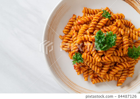 spirali or spiral pasta with tomato sauce spirali or spiral pasta with tomato sauce 84487126
