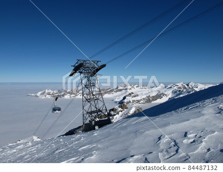 High above the fog, Cable car on the Titlis High above the fog, Cable car on the Titlis 84487132