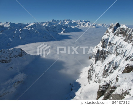 Beautiful mountain landscape in the winter, sea of fog Beautiful mountain landscape in the winter, sea of fog 84487212