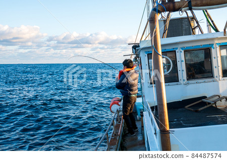 People fishing in the sea 84487574