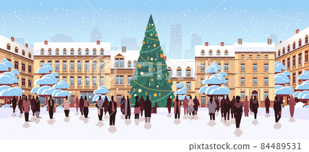 people silhouettes walking near decorated christmas tree on city street new year holidays celebration 84489531