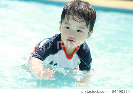 Boys playing in the water 84490134