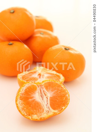 Mandarin oranges split in half Mandarin oranges split in half 84490830