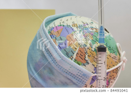 Globe in face mask and syringe. New vaccine against Covid-19 Omicron variant. Symbol of global roll-out new generation of vaccine against Omicron strain of coronavirus. Omicron variant vaccine Globe in face mask and syringe. New vaccine against Covid-19 Omicron variant. Symbol of global roll-out new generation of vaccine against Omicron strain of coronavirus. Omicron variant vaccine 84491041