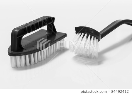 Plastic brushes for cleaning on white background. Plastic brushes for cleaning on white background. 84492412