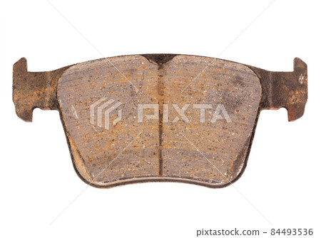 Old worn out and worn out brake pad on a white background, close-up, isolate. Concept of performance and composition of friction linings, braking Old worn out and worn out brake pad on a white background, close-up, isolate. Concept of performance and composition of friction linings, braking 84493536