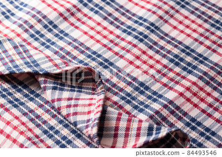 Checkered multi-colored fabric, close-up. Decoration Checkered multi-colored fabric, close-up. Decoration 84493546