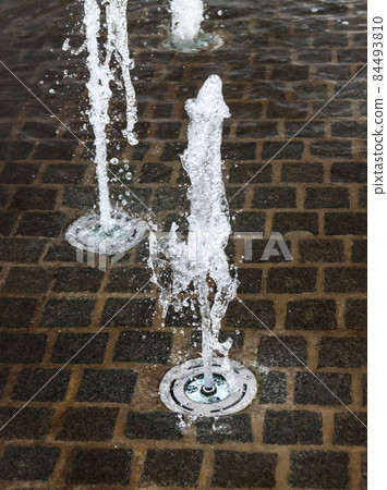 Short exposure photo of a few small fountains in Kouvola, Finland on a summer day. 84493810