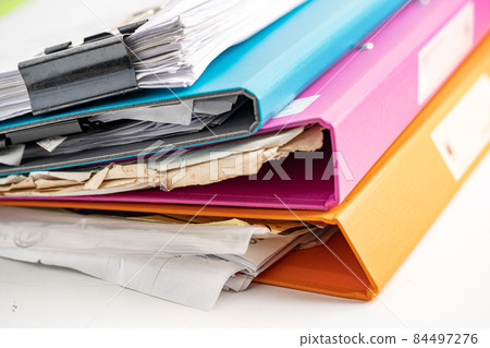 File Folder Binder stack of multi color on table in business office. File Folder Binder stack of multi color on table in business office. 84497276