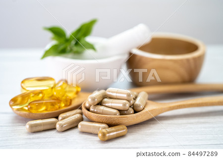 Alternative medicine herbal organic capsule with vitamin E omega 3 fish oil, mineral, drug with herbs leaf natural supplements for healthy good life. Alternative medicine herbal organic capsule with vitamin E omega 3 fish oil, mineral, drug with herbs leaf natural supplements for healthy good life. 84497289