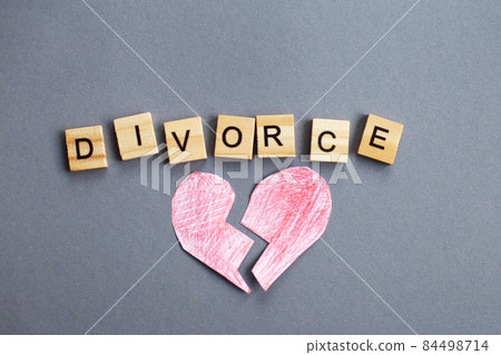 broken heart on gray background and inscription divorce made by wooden blocks. broken family concept broken heart on gray background and inscription divorce made by wooden blocks. broken family concept 84498714