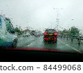 Driving with heavy rain on car windscreen 84499068