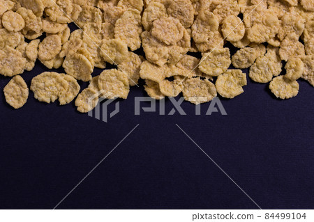 corn flakes on a black background top 84499104