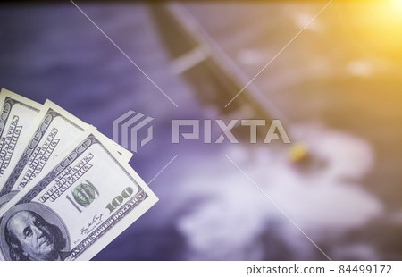 Money dollars on the background of a TV on which show sailing, sports betting, money dollars 84499172