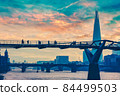 Millennium Bridge and the River Thames in London 84499503