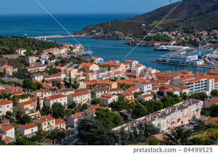 Aerial view of Port Vendres town with its church and trawler at dock, Mediterranean sea, Roussillon Aerial view of Port Vendres town with its church and trawler at dock, Mediterranean sea, Roussillon 84499525