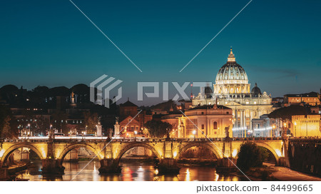Rome, Italy. Papal Basilica Of St. Peter In The Vatican And Aelian Bridge In Evening Night Illuminations 84499665