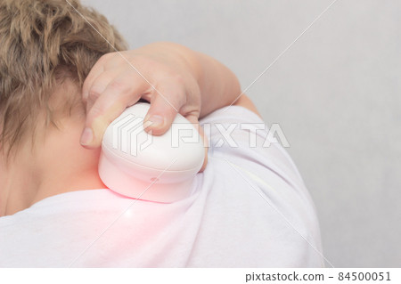 Physiotherapy of the cervical spine with the help of physiotherapy, a magnet, reducing inflammation and improving blood circulation, copy space Physiotherapy of the cervical spine with the help of physiotherapy, a magnet, reducing inflammation and improving blood circulation, copy space 84500051