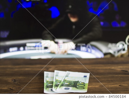 Euro money on the background of TV on which show the game of cards, poker, sports betting, euro money Euro money on the background of TV on which show the game of cards, poker, sports betting, euro money 84500184