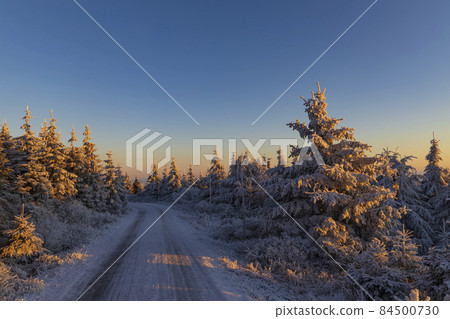Sunrise in winter landscape near Velka Destna, Orlicke mountains, Eastern Bohemia, Czech Republic 84500730
