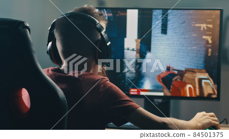 Teen gamer celebrating victory in match Teen gamer celebrating victory in match 84501375