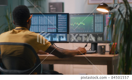 Black financial trader working from home Black financial trader working from home 84501557