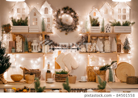 Christmas decor. electric garlands on decorated in kitchen for new year. Christmas decor. electric garlands on decorated in kitchen for new year. 84501558