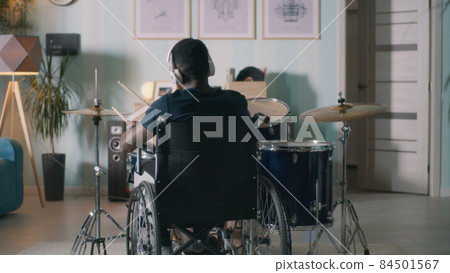 Unrecognizable drummer in home studio 84501567