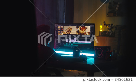 Teenager editing video on computer 84501621