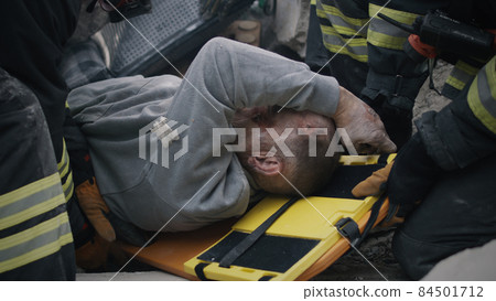 Injured senior man speaking with rescuers Injured senior man speaking with rescuers 84501712