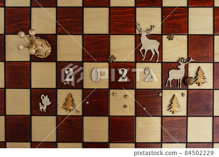 concept photography, new year composition on a chessboard, 2022, Flat lay concept photography, new year composition on a chessboard, 2022, Flat lay 84502229